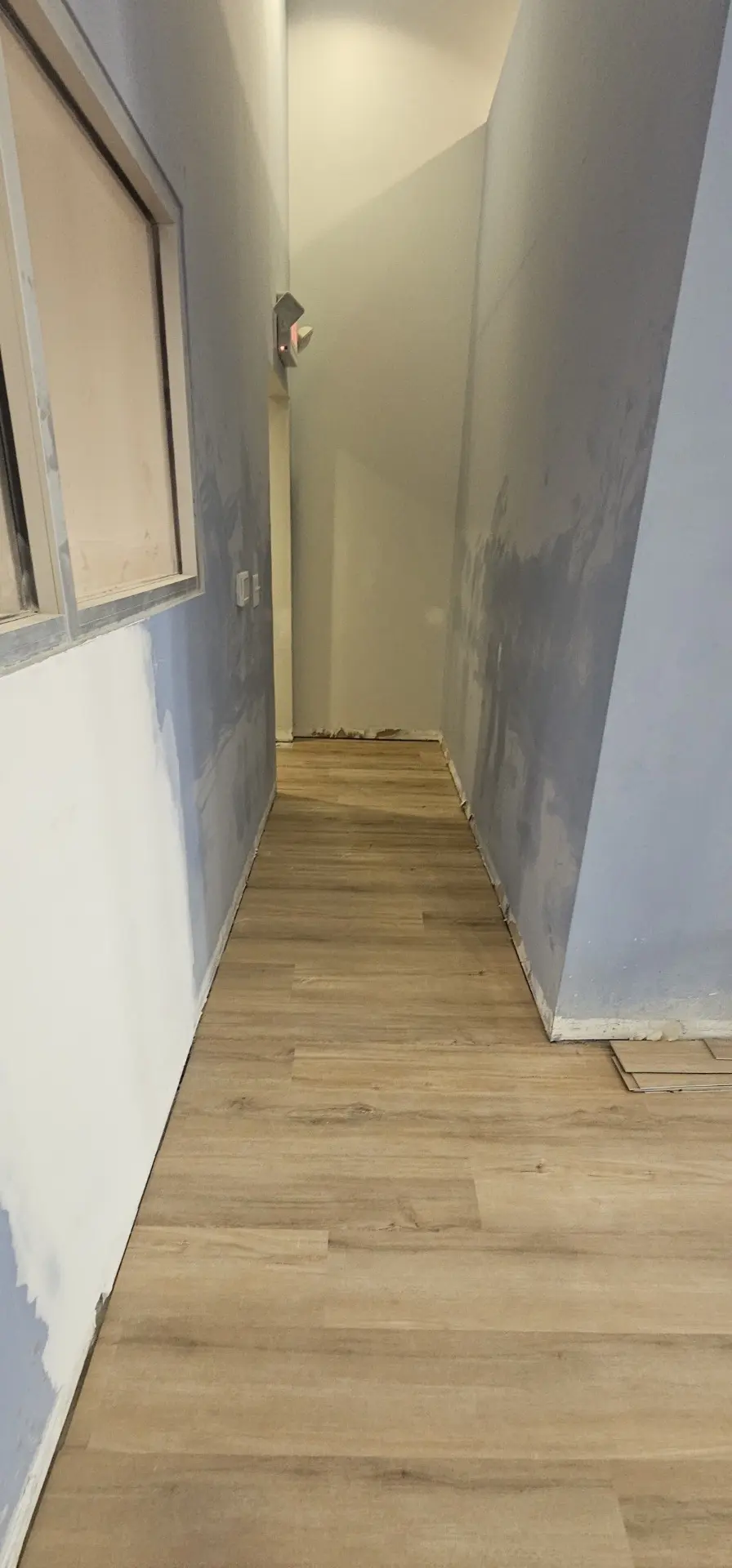 Commercial hallway with new luxury vinyl plank flooring installed