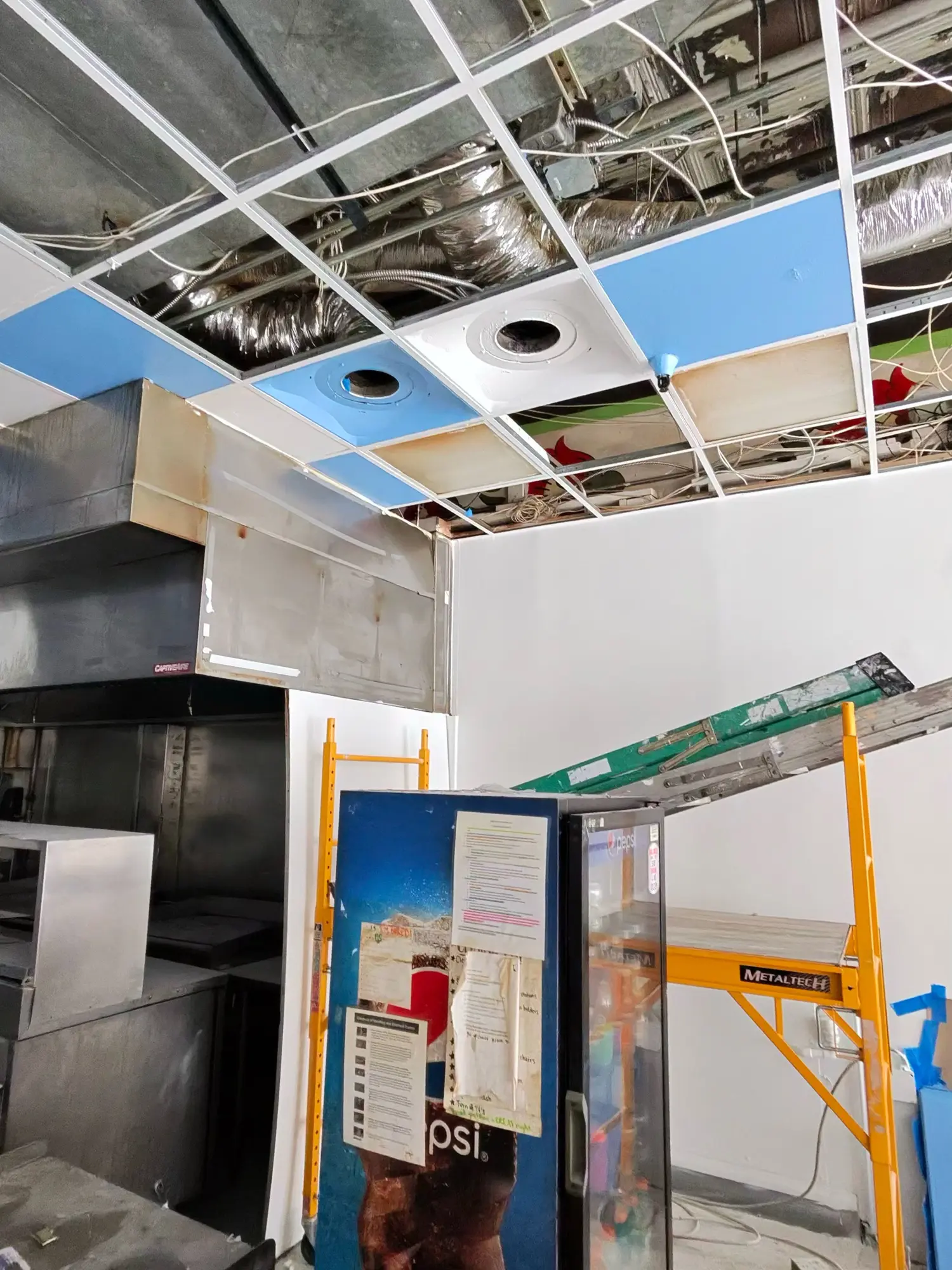 Commercial kitchen during renovation with scaffold in place