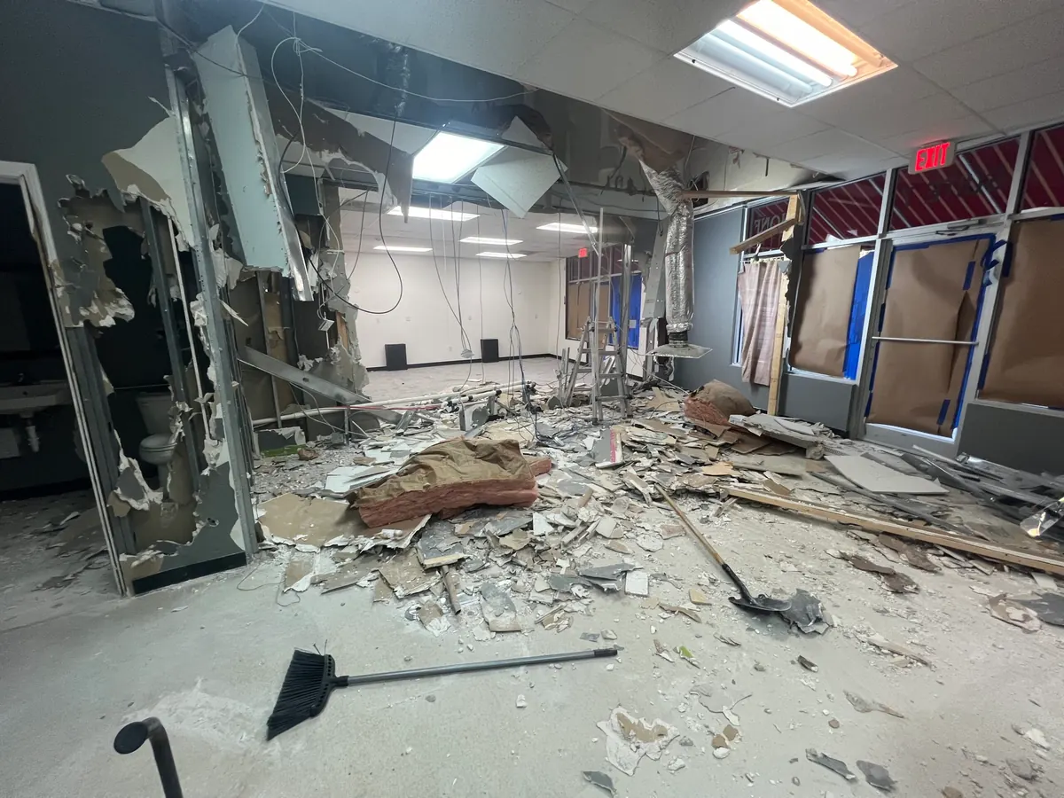 Interior wall demolition in progress in a commercial unit