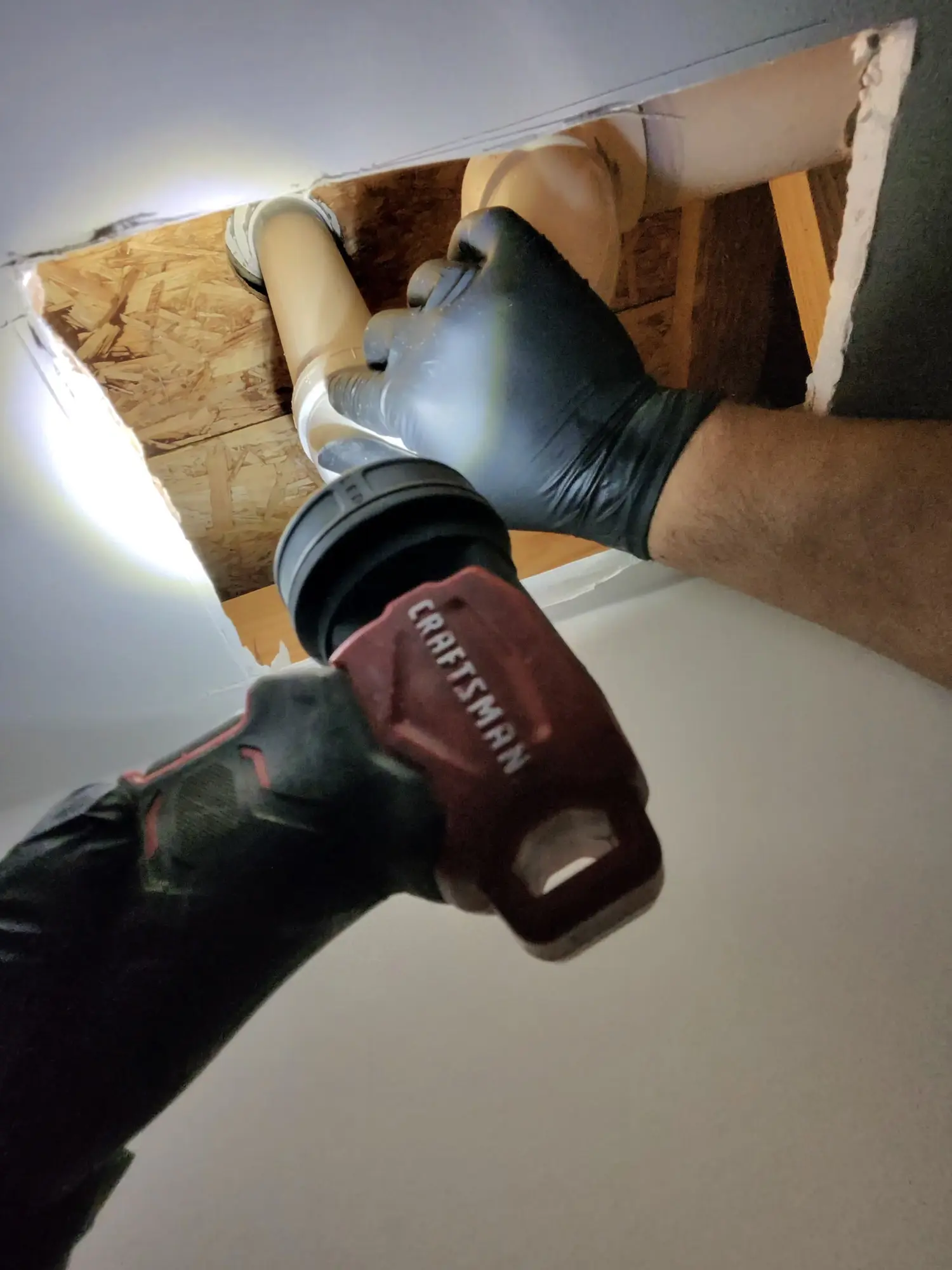 Drilling through a cabinet base for plumbing access