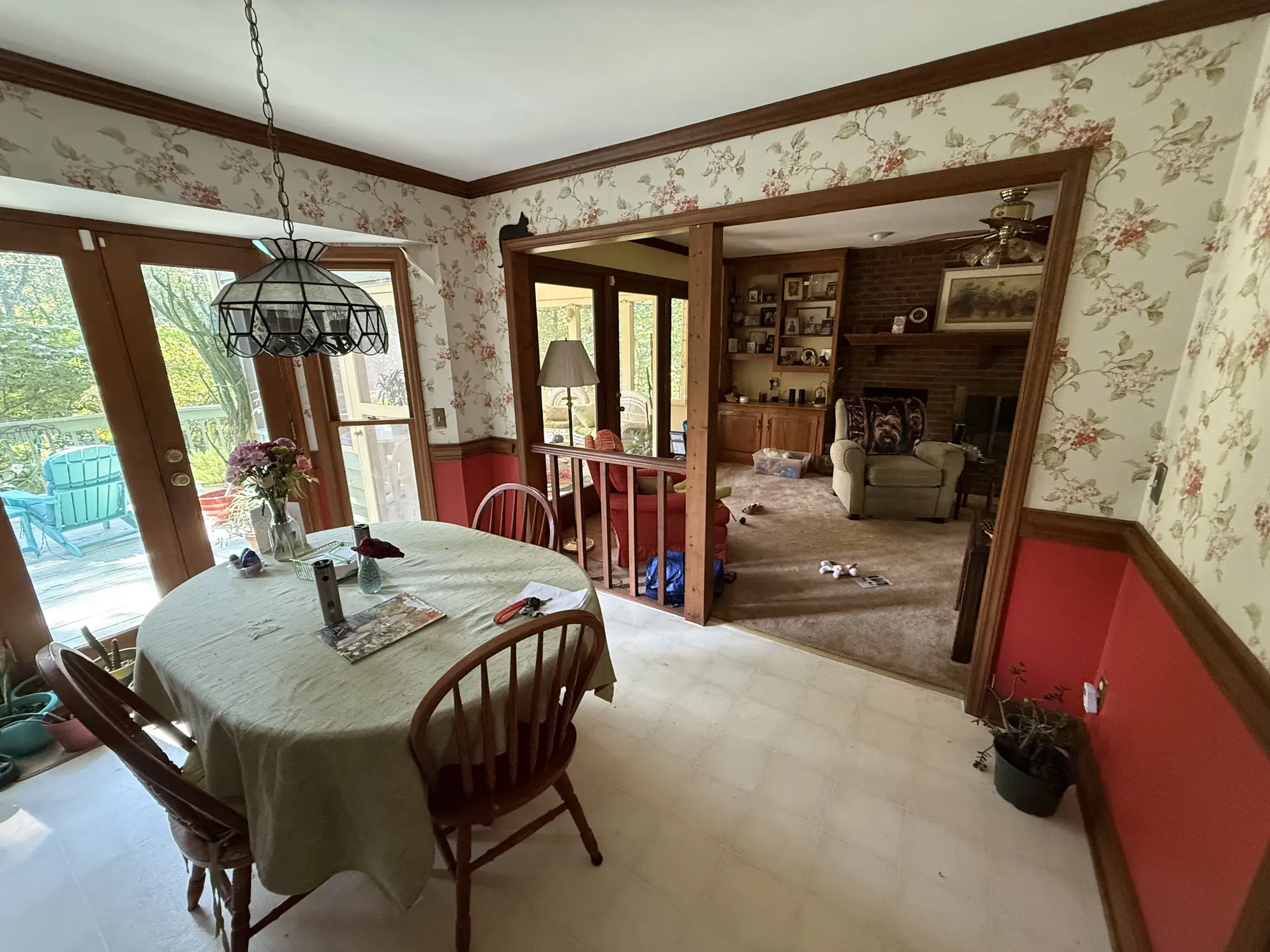 Breakfast room with wallpaper and tile floor before remodel
