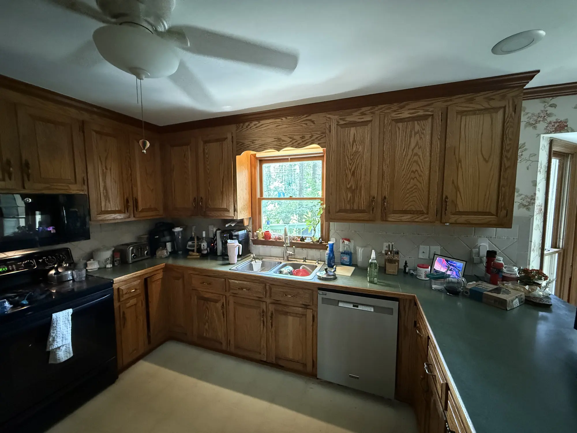 Kitchen sink wall and window before remodel