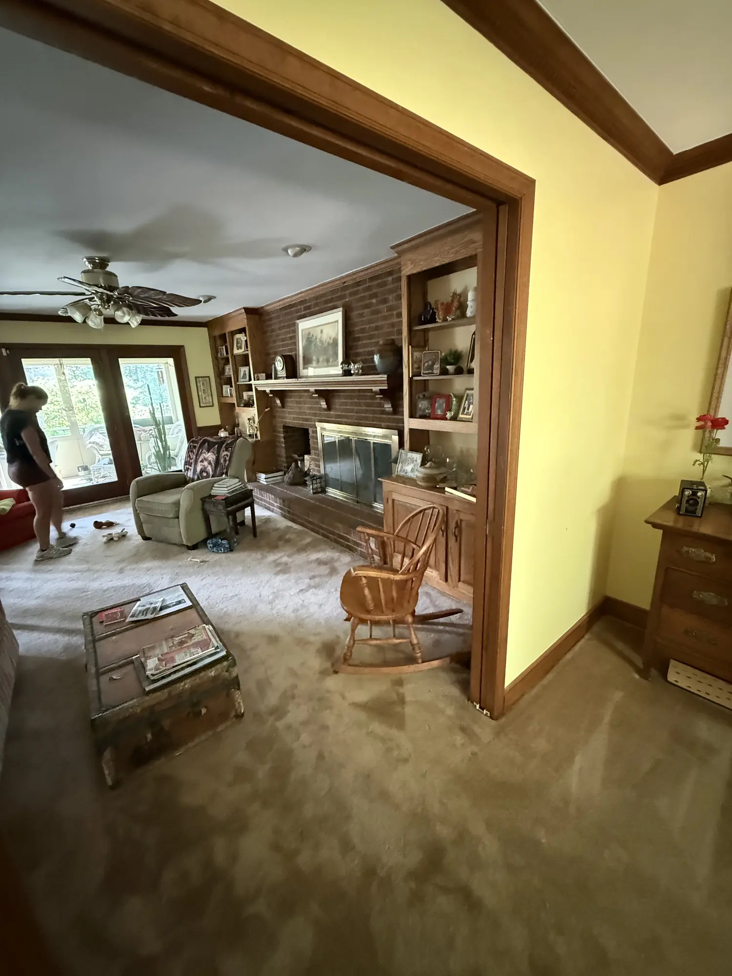 View through a doorway into the living room before remodel