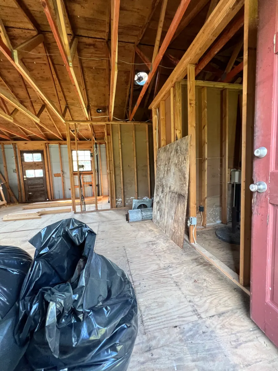 House interior stripped to the studs during a full gut remodel