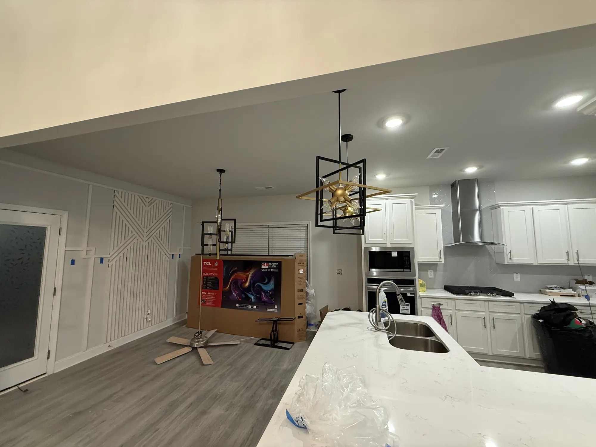 Open plan kitchen and geometric feature wall taking shape during a remodel