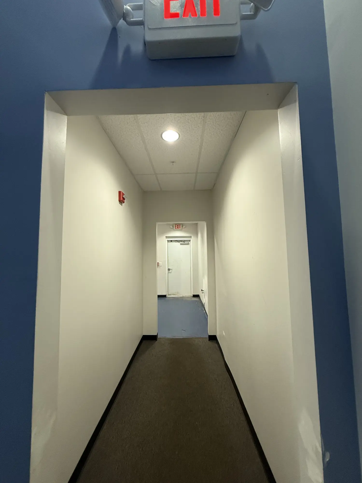 Commercial corridor repainted with the exit route kept clear