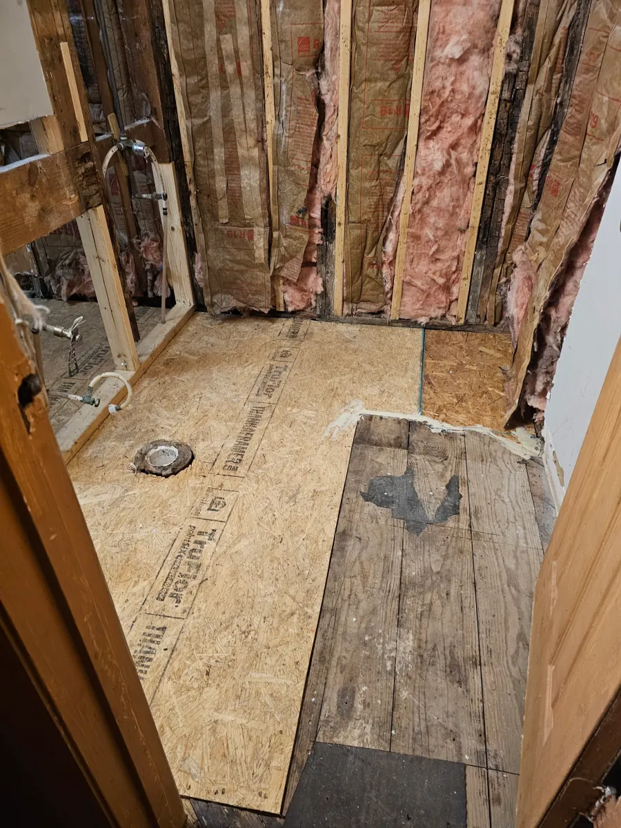 New framing and subfloor installed where water damage was cut out