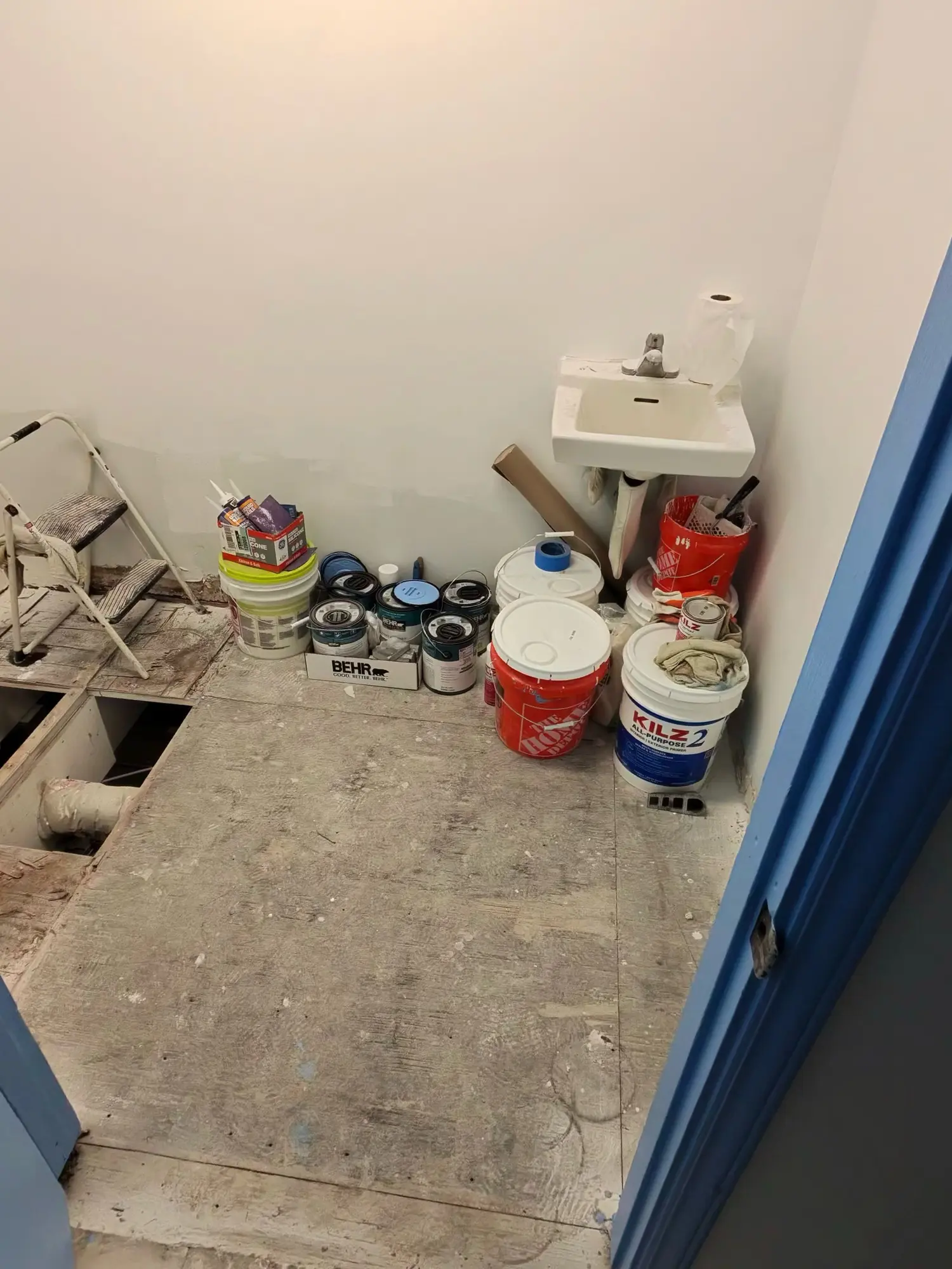 Commercial restroom during renovation with floor removed