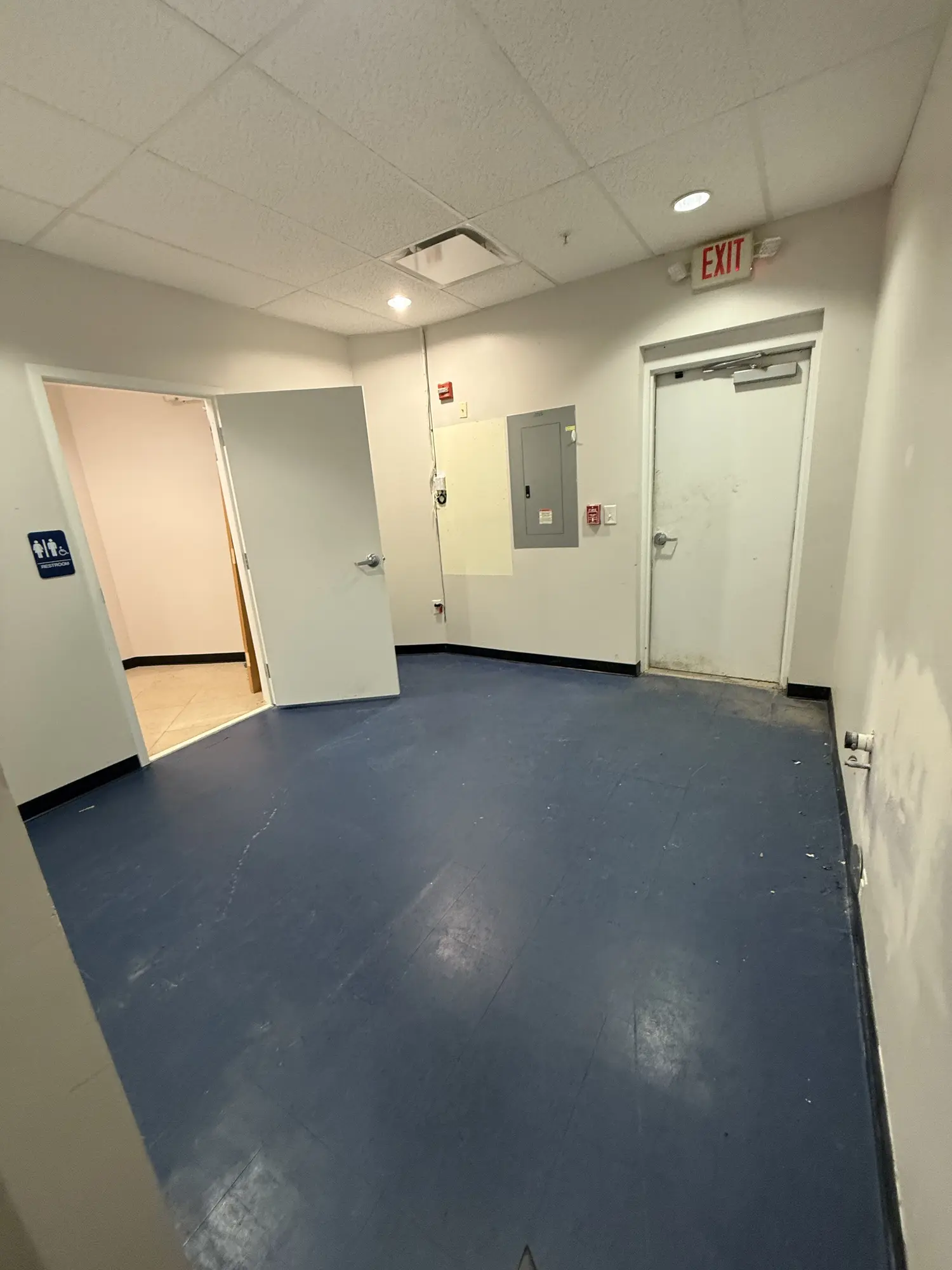 Utility room repainted with a blue coated floor
