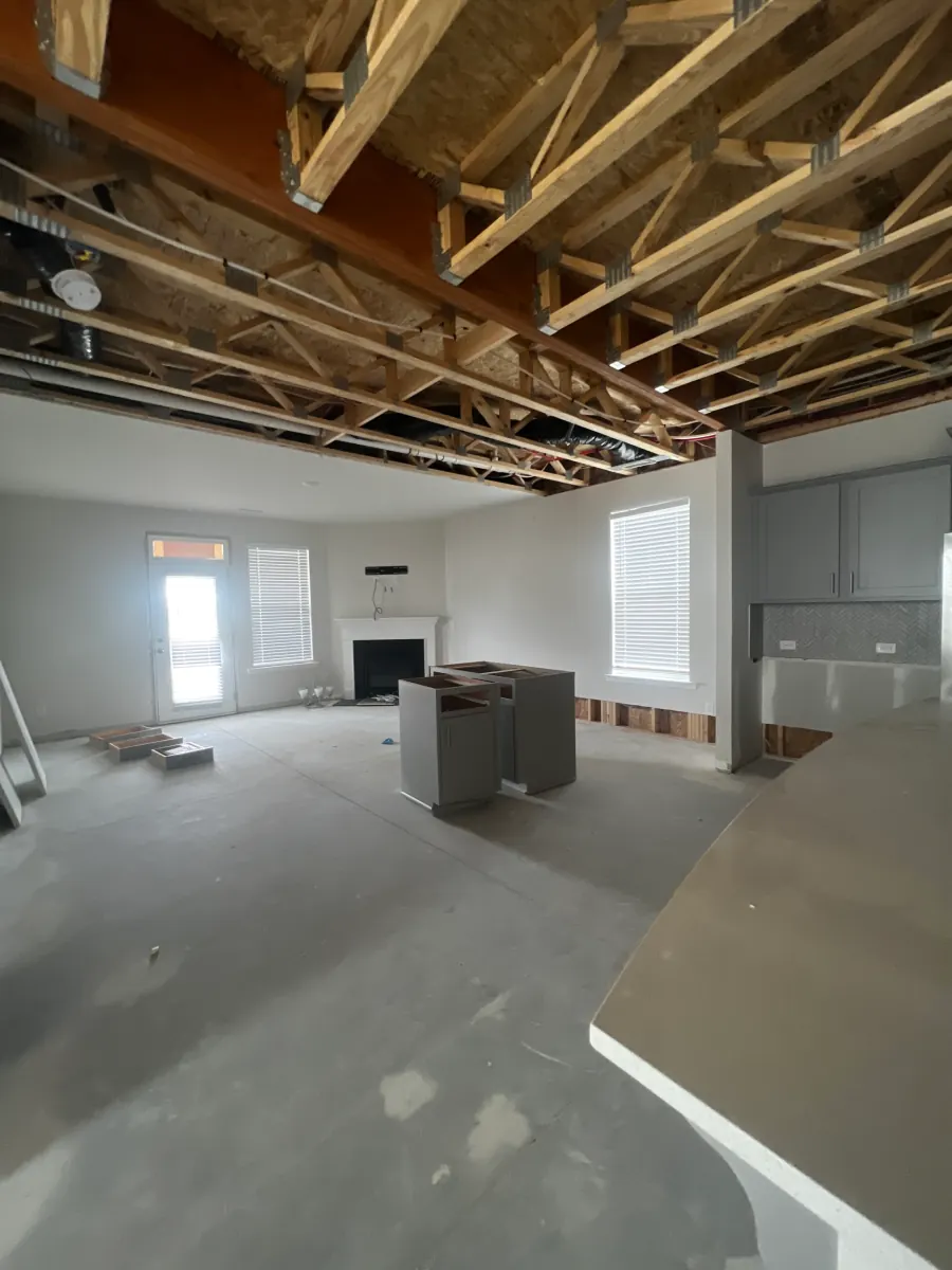 Room mid restoration with ceiling opened and new drywall going in